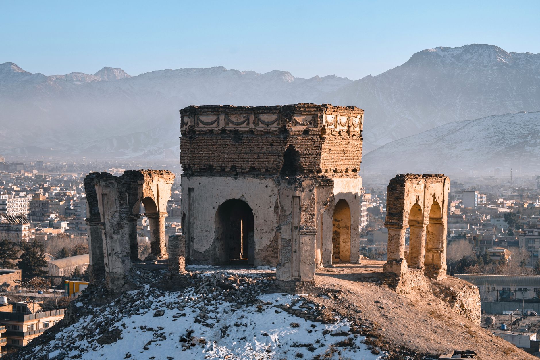 Ancient minaret and mountains in the landscape of Afghanistan