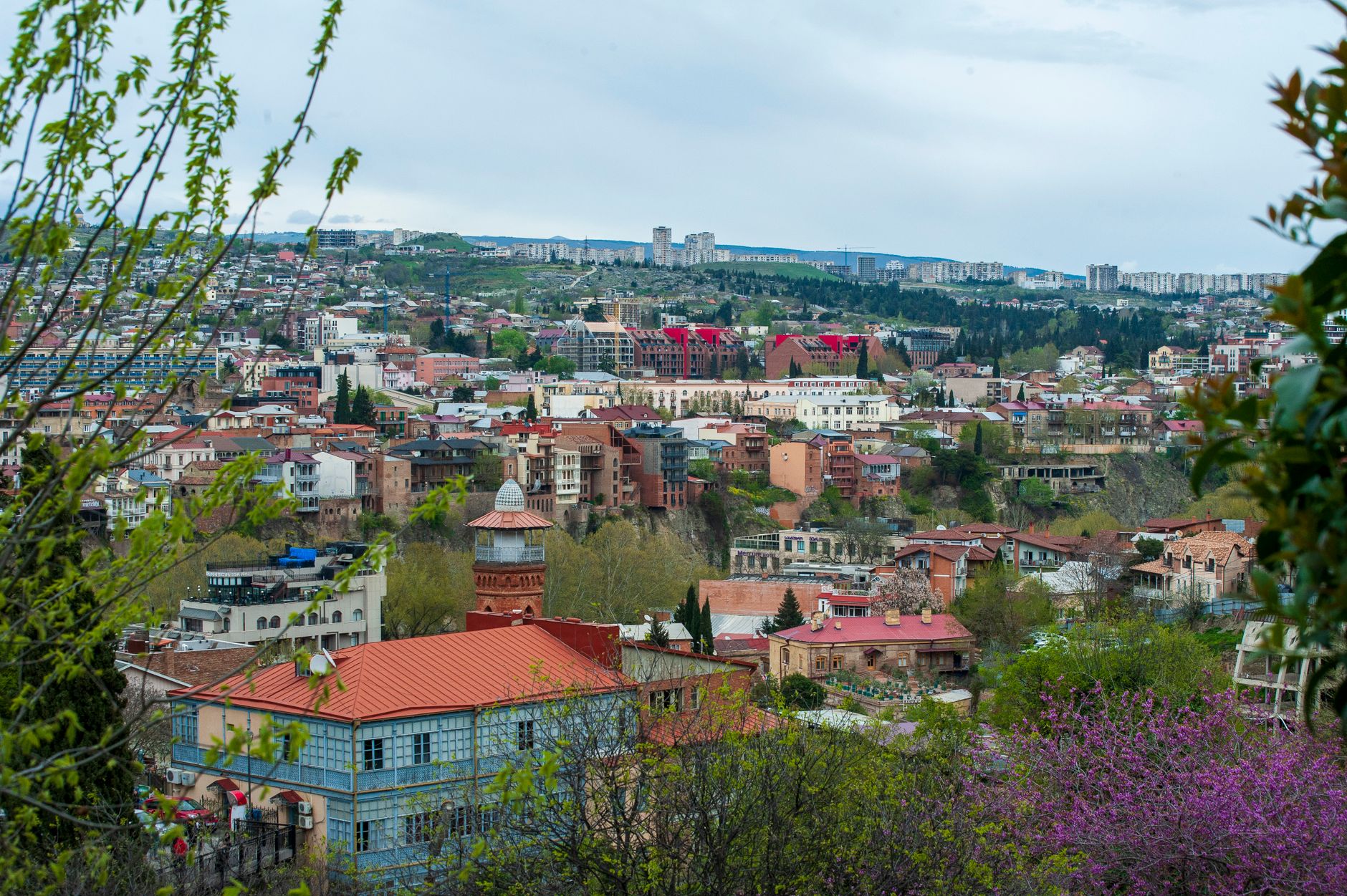Colorful balconied houses and Narikala fortress in Tbilisi, Georgia
