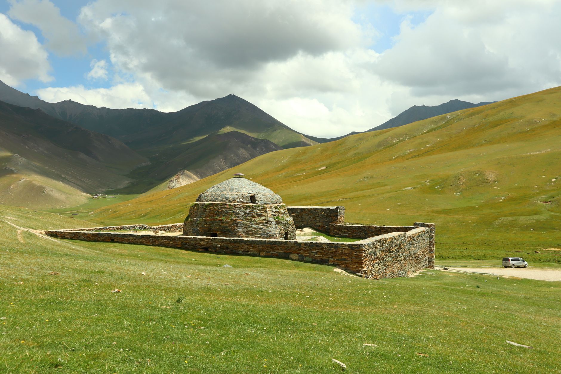 Tian Shan mountains and traditional yurt camp by Song-Kul lake, Kyrgyzstan