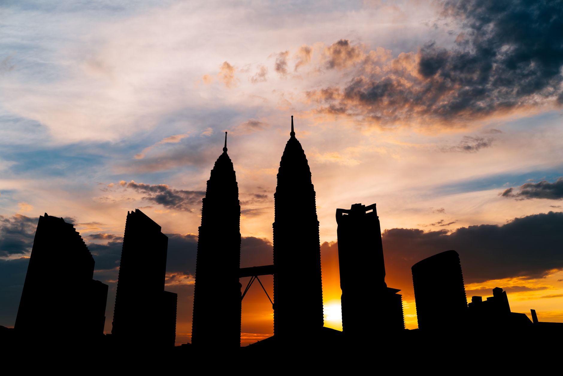 Petronas Twin Towers and street life in Kuala Lumpur, Malaysia