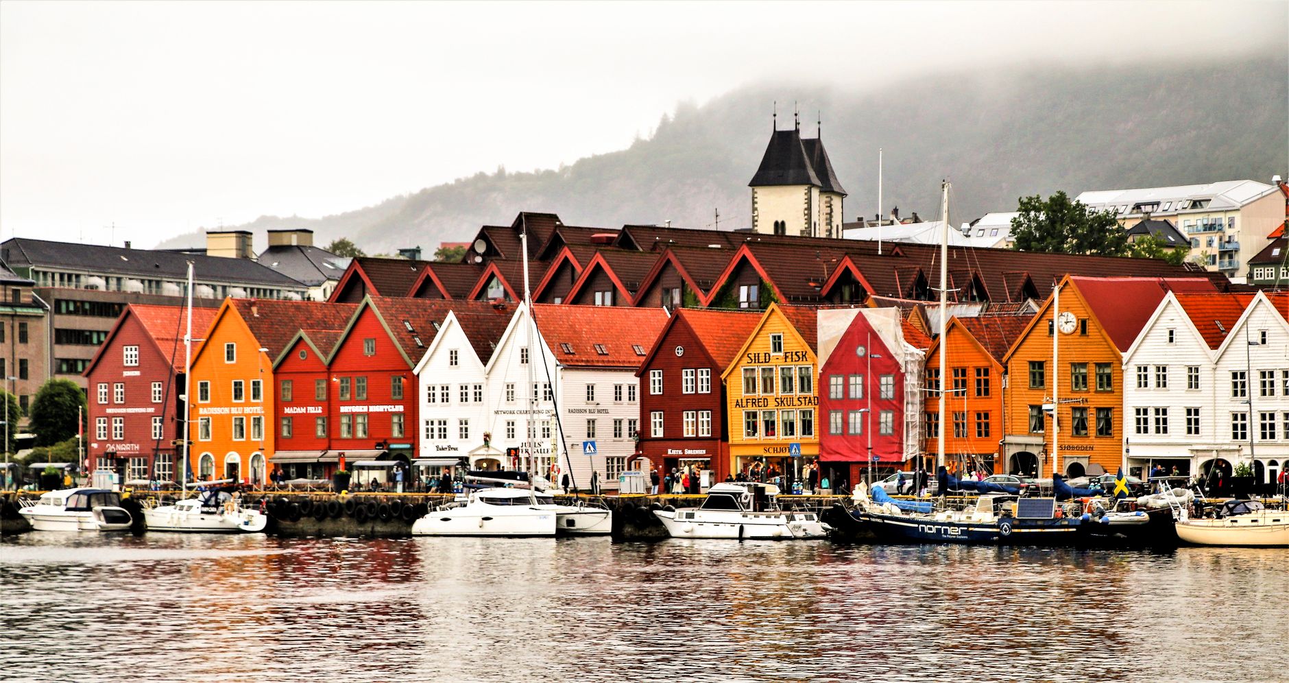 Fjord landscape with mountains and village in Norway